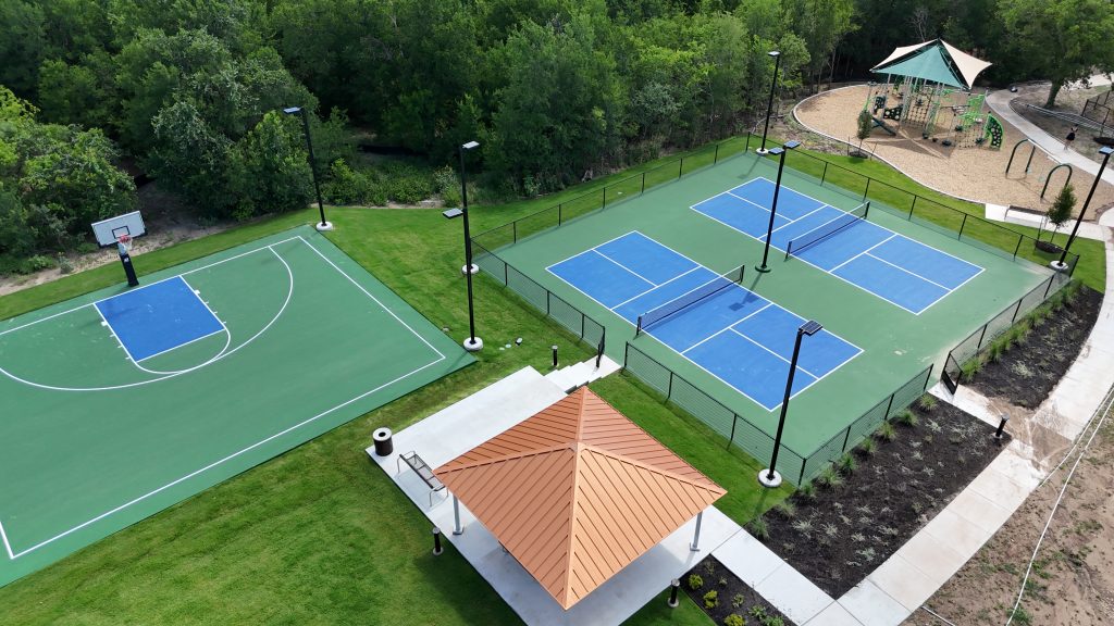 Aerial photo of community sports courts with trees